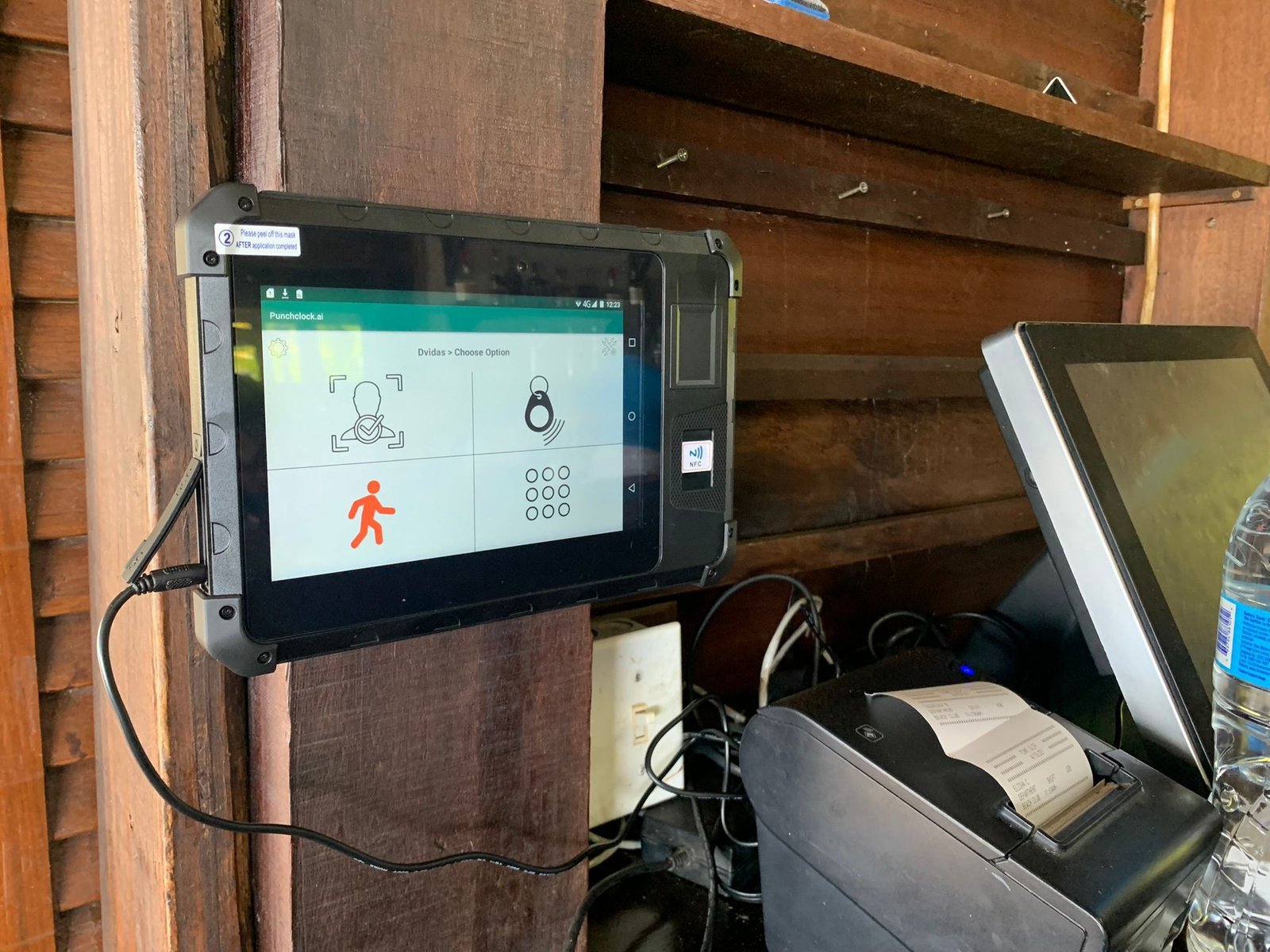 Punchclock AI wall-mounted timekeeping tablet